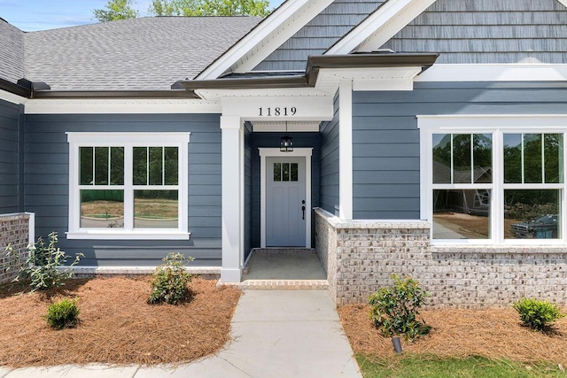 11819 Herons Haven Dr # 102, Soddy Daisy, TN 37379 - entrance to property with a shingled roof