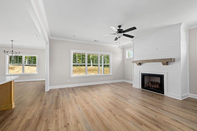 11819 Herons Haven Dr # 102, Soddy Daisy, TN 37379 - unfurnished living room with healthy amount of natural light, light wood-style flooring, crown molding, baseboards, and ceiling fan