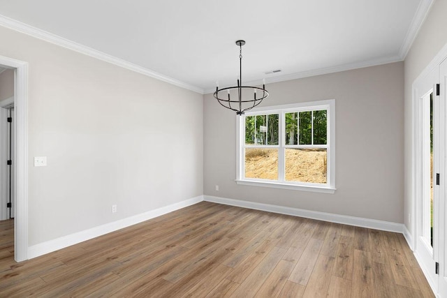 11819 Herons Haven Dr # 102, Soddy Daisy, TN 37379 - empty room featuring a chandelier, light wood-type flooring, baseboards, and ornamental molding