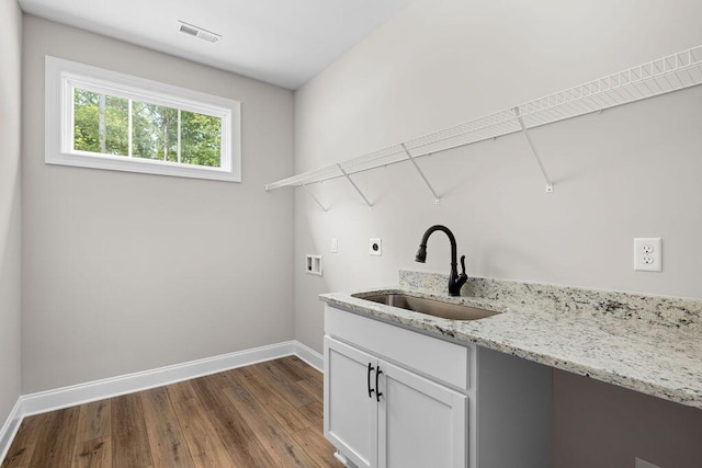 11819 Herons Haven Dr # 102, Soddy Daisy, TN 37379 - laundry room featuring a sink, washer hookup, electric dryer hookup, baseboards, and dark wood-type flooring