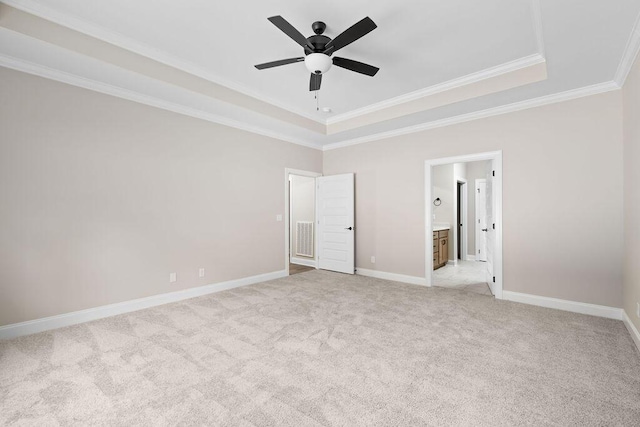 11819 Herons Haven Dr # 102, Soddy Daisy, TN 37379 - unfurnished bedroom featuring a tray ceiling, crown molding, light colored carpet, baseboards, and connected bathroom