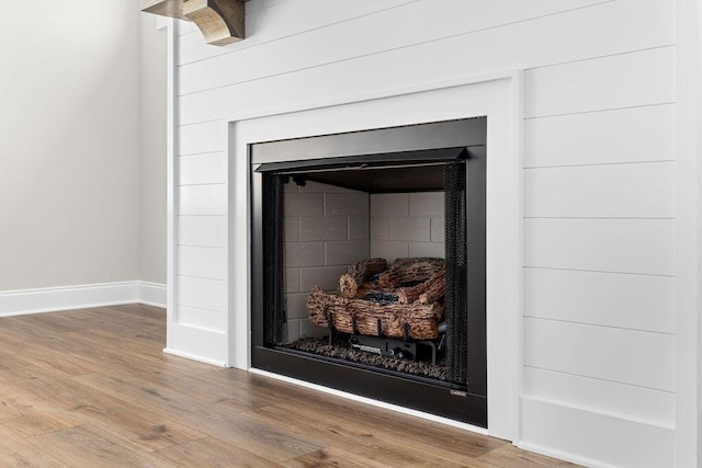 11819 Herons Haven Dr # 102, Soddy Daisy, TN 37379 - detailed view of a fireplace, wood finished floors, and baseboards