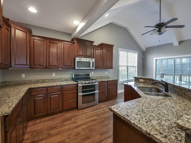 7954 Burgundy Cir Unit 91, Chattanooga, TN 37421 - kitchen with dark wood-style flooring, lofted ceiling with beams, a sink, ceiling fan, and appliances with stainless steel finishes