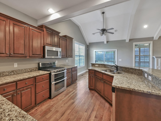 7954 Burgundy Cir Unit 91, Chattanooga, TN 37421 - kitchen with lofted ceiling with beams, light wood-style flooring, ceiling fan, appliances with stainless steel finishes, and a sink