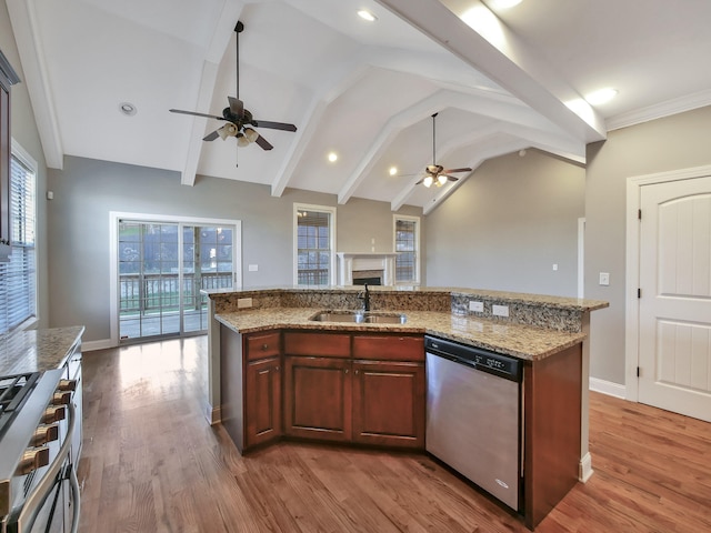 7954 Burgundy Cir Unit 91, Chattanooga, TN 37421 - kitchen featuring ceiling fan, wood finished floors, appliances with stainless steel finishes, a sink, and vaulted ceiling with beams