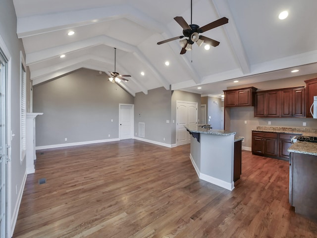 7954 Burgundy Cir Unit 91, Chattanooga, TN 37421 - kitchen featuring light stone counters, a ceiling fan, dark wood-style floors, open floor plan, and baseboards