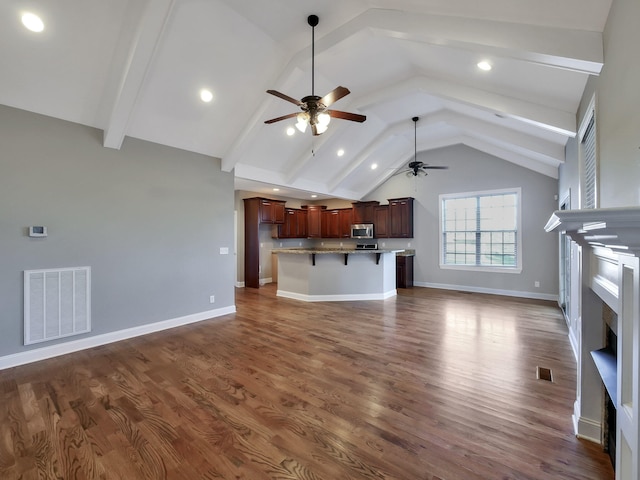 7954 Burgundy Cir Unit 91, Chattanooga, TN 37421 - unfurnished living room with dark wood-style flooring, visible vents, baseboards, a fireplace, and a ceiling fan