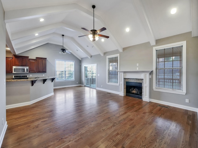 7954 Burgundy Cir Unit 91, Chattanooga, TN 37421 - unfurnished living room featuring a ceiling fan, a fireplace, baseboards, visible vents, and dark wood-type flooring