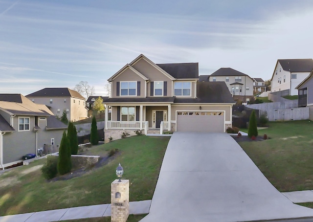 7954 Burgundy Cir Unit 91, Chattanooga, TN 37421 - view of front of house with a residential view, a porch, concrete driveway, and a garage