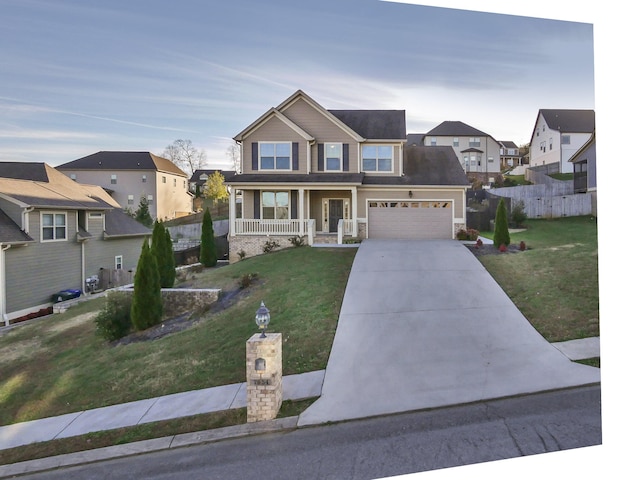 7954 Burgundy Cir Unit 91, Chattanooga, TN 37421 - view of front of property with fence, concrete driveway, a front yard, a residential view, and covered porch