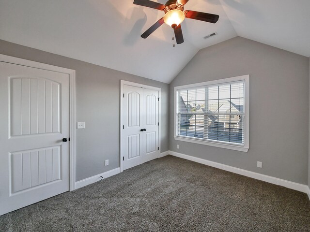 7954 Burgundy Cir Unit 91, Chattanooga, TN 37421 - unfurnished bedroom featuring dark carpet, lofted ceiling, visible vents, and baseboards