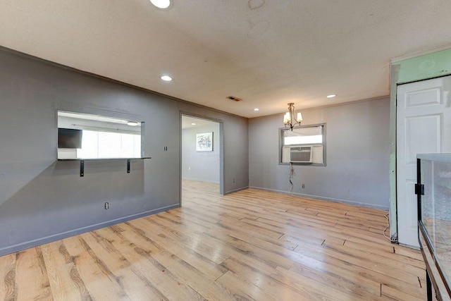 934 Hulana St, Rossville, GA 30741 - unfurnished room with light wood finished floors, visible vents, a notable chandelier, and ornamental molding