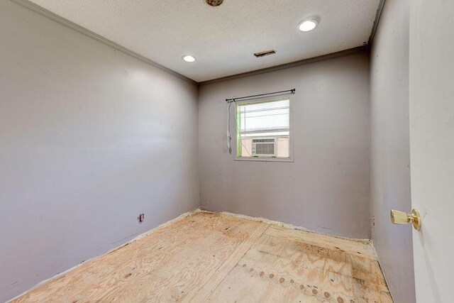 934 Hulana St, Rossville, GA 30741 - unfurnished room featuring cooling unit, ornamental molding, a textured ceiling, and visible vents