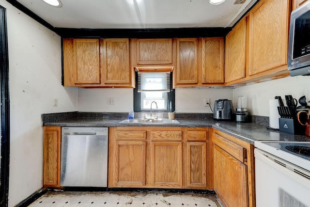 934 Hulana St, Rossville, GA 30741 - kitchen with a sink, dark countertops, light floors, and appliances with stainless steel finishes