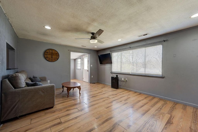 934 Hulana St, Rossville, GA 30741 - living area with light wood finished floors, baseboards, visible vents, and ceiling fan