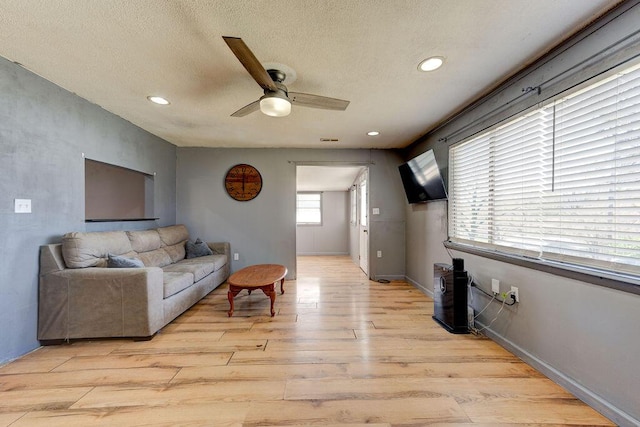 934 Hulana St, Rossville, GA 30741 - living room with a textured ceiling, baseboards, light wood-style floors, ceiling fan, and recessed lighting