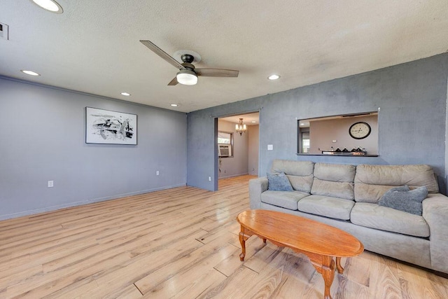 934 Hulana St, Rossville, GA 30741 - living room featuring visible vents, baseboards, wood finished floors, recessed lighting, and ceiling fan with notable chandelier