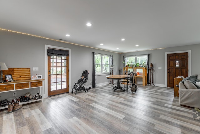 dining room featuring recessed lighting, visible vents, baseboards, and wood finished floors
