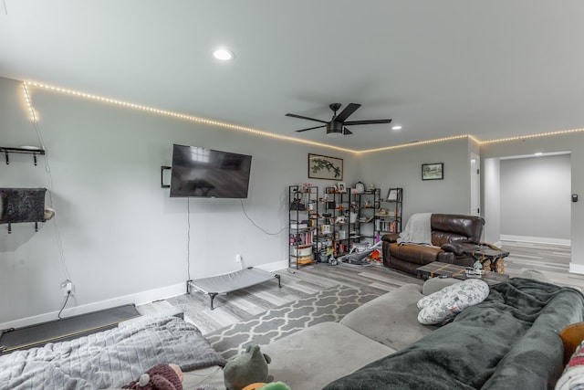 living area featuring recessed lighting, baseboards, a ceiling fan, and wood finished floors