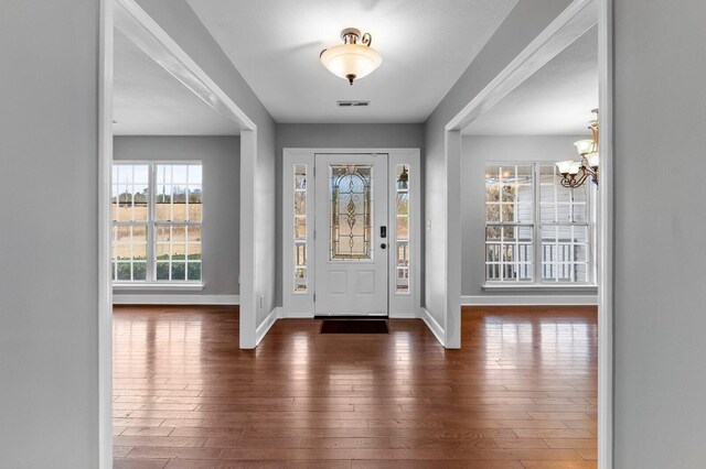 204 Lake Haven Dr, Soddy Daisy, TN 37379 - entrance foyer with a chandelier, wood-type flooring, and baseboards