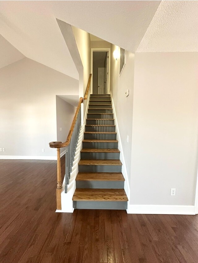 204 Lake Haven Dr, Soddy Daisy, TN 37379 - stairway featuring baseboards, wood finished floors, lofted ceiling, and a textured ceiling
