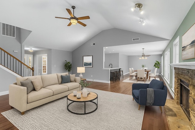 204 Lake Haven Dr, Soddy Daisy, TN 37379 - living area featuring wood finished floors, ceiling fan, stairway, a fireplace, and baseboards
