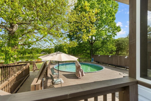 204 Lake Haven Dr, Soddy Daisy, TN 37379 - view of swimming pool featuring a wooden deck, fence, and view of wooded area