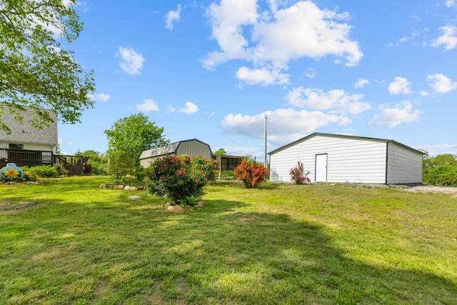 204 Lake Haven Dr, Soddy Daisy, TN 37379 - view of green lawn with an outbuilding and a wooden deck