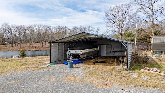 204 Lake Haven Dr, Soddy Daisy, TN 37379 - view of parking / parking lot featuring a detached carport and a water view