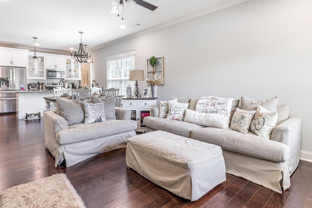 137 Elm Ave, Ringgold, GA 30736 - living area featuring ornamental molding, ceiling fan with notable chandelier, visible vents, and dark wood-type flooring