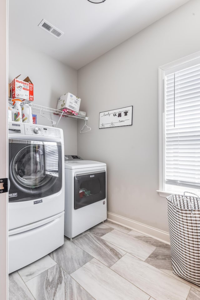137 Elm Ave, Ringgold, GA 30736 - clothes washing area featuring laundry area, washer and clothes dryer, visible vents, baseboards, and marble finish floor