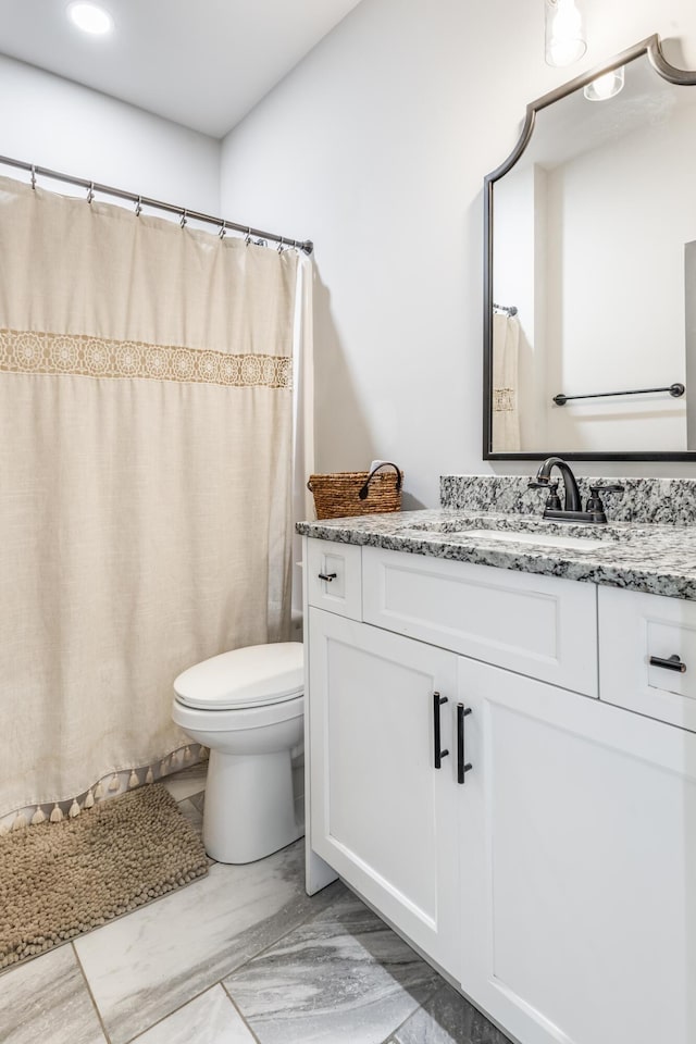 137 Elm Ave, Ringgold, GA 30736 - full bathroom with toilet, marble finish floor, vanity, and a shower with curtain