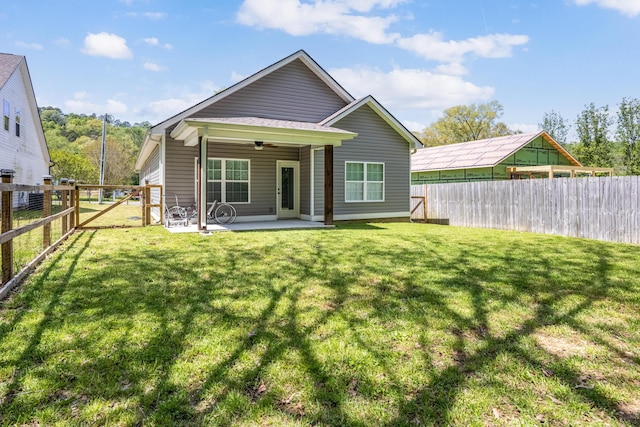 137 Elm Ave, Ringgold, GA 30736 - rear view of property with a fenced backyard, a patio area, a ceiling fan, and a lawn