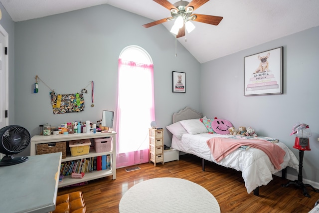bedroom featuring vaulted ceiling, visible vents, wood finished floors, and ceiling fan