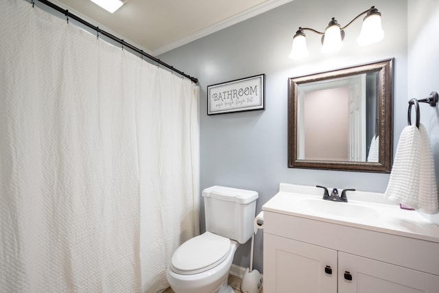 full bath featuring toilet, vanity, and crown molding