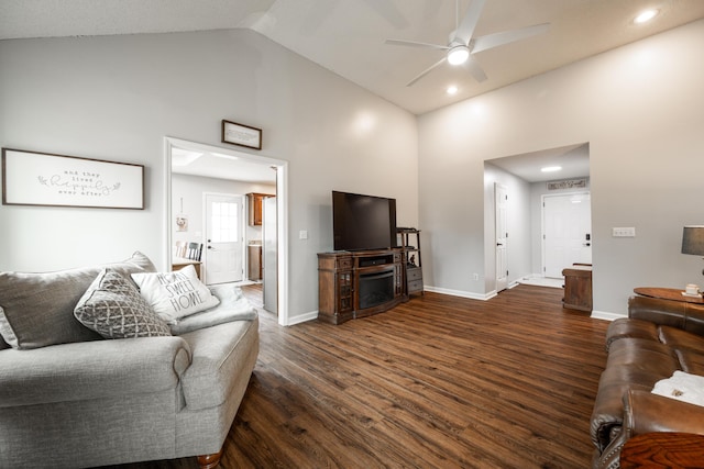 living area featuring high vaulted ceiling, a ceiling fan, dark wood finished floors, baseboards, and recessed lighting