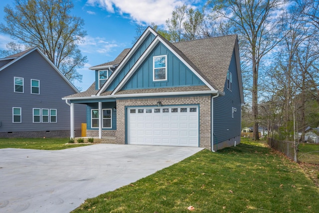 craftsman-style house with brick siding, a front yard, board and batten siding, and driveway