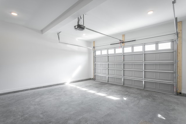 garage with baseboards, recessed lighting, and a garage door opener
