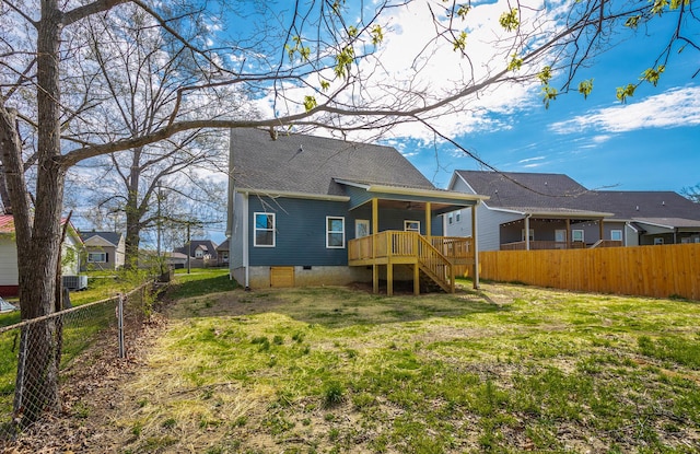 back of house with stairway, crawl space, central air condition unit, a deck, and a fenced backyard