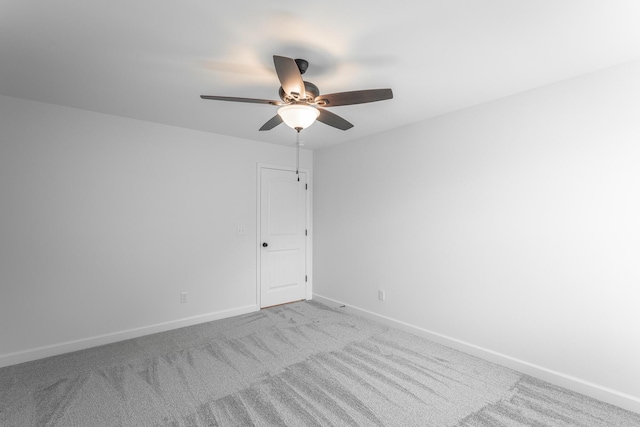 unfurnished room featuring ceiling fan, baseboards, and carpet flooring
