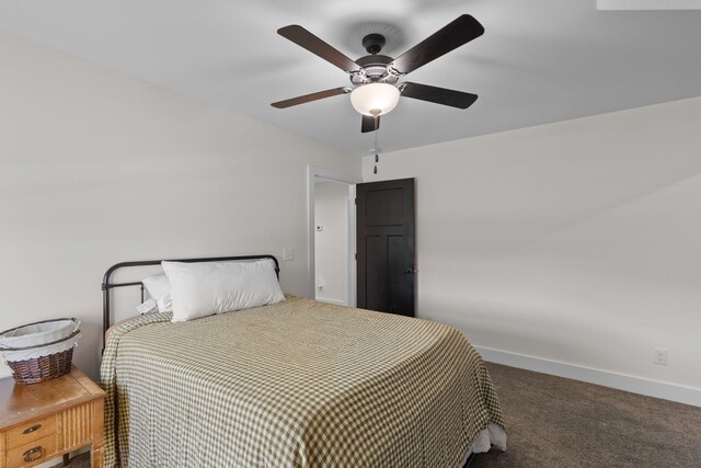 carpeted bedroom featuring baseboards and ceiling fan