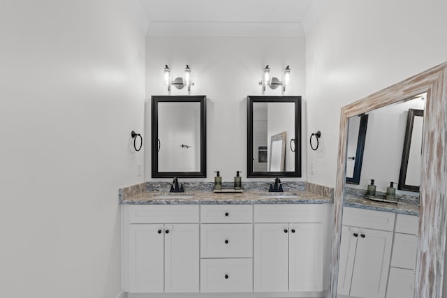 bathroom with double vanity, ornamental molding, and a sink