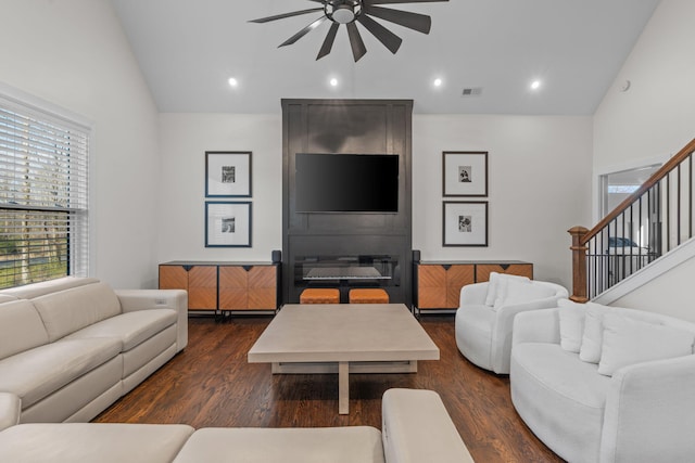 living room featuring dark wood-style flooring, visible vents, stairs, recessed lighting, and a ceiling fan
