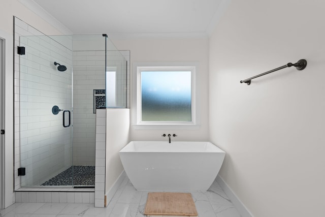 bathroom featuring crown molding, baseboards, a shower stall, a soaking tub, and marble finish floor