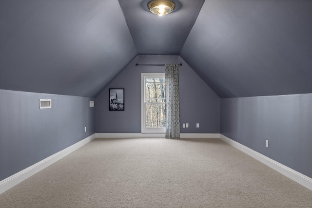 bonus room featuring light carpet, baseboards, vaulted ceiling, and visible vents