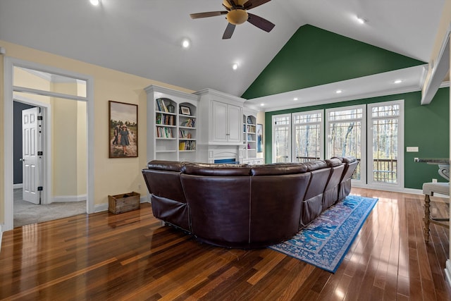 living area with recessed lighting, high vaulted ceiling, baseboards, a ceiling fan, and wood finished floors