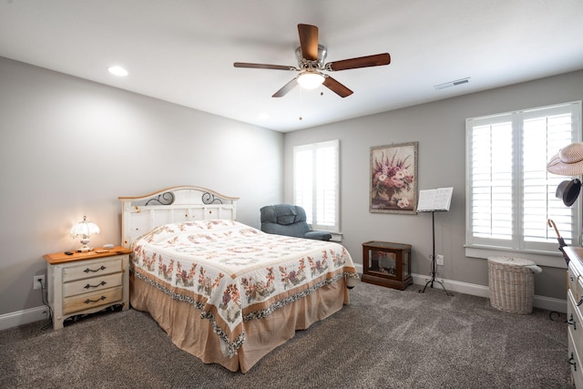 8975 Silver Maple Dr, Ooltewah, TN 37363 - bedroom featuring multiple windows, visible vents, dark colored carpet, and baseboards