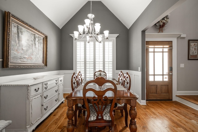 8975 Silver Maple Dr, Ooltewah, TN 37363 - dining area with plenty of natural light, vaulted ceiling, a chandelier, and light wood-type flooring