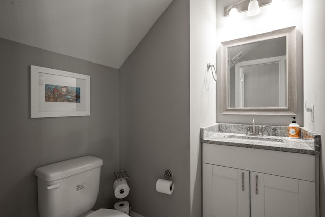 8975 Silver Maple Dr, Ooltewah, TN 37363 - bathroom with vaulted ceiling, toilet, and vanity