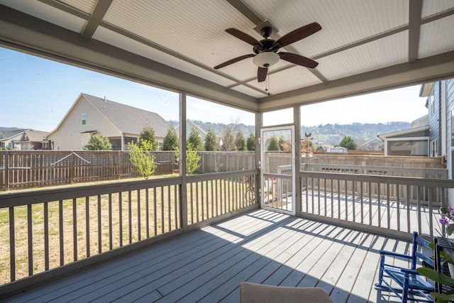8975 Silver Maple Dr, Ooltewah, TN 37363 - wooden terrace featuring a ceiling fan, a fenced backyard, and a residential view